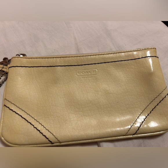 COACH cream parent wristlet. USED - Picture 1 of 4